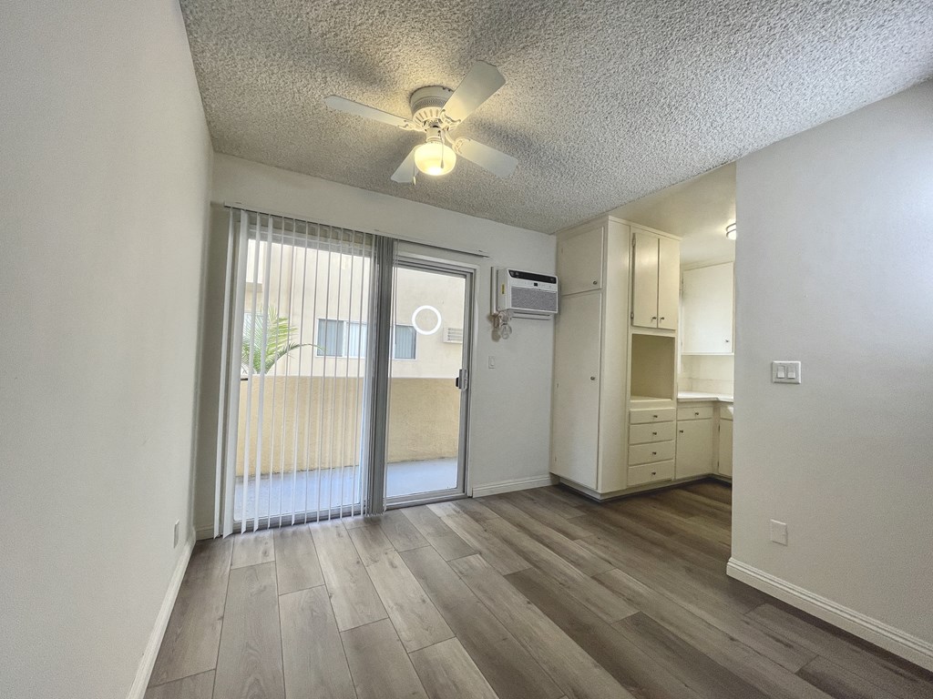 Dining Room with Hardwood Floors and Fan