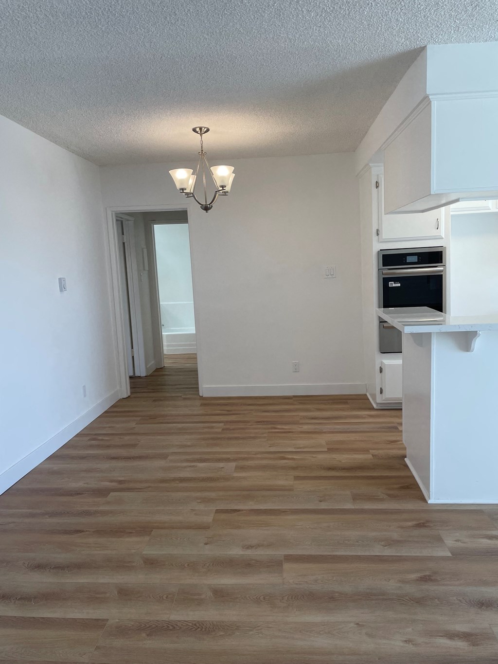 a kitchen and living room in a 555 waverly unit