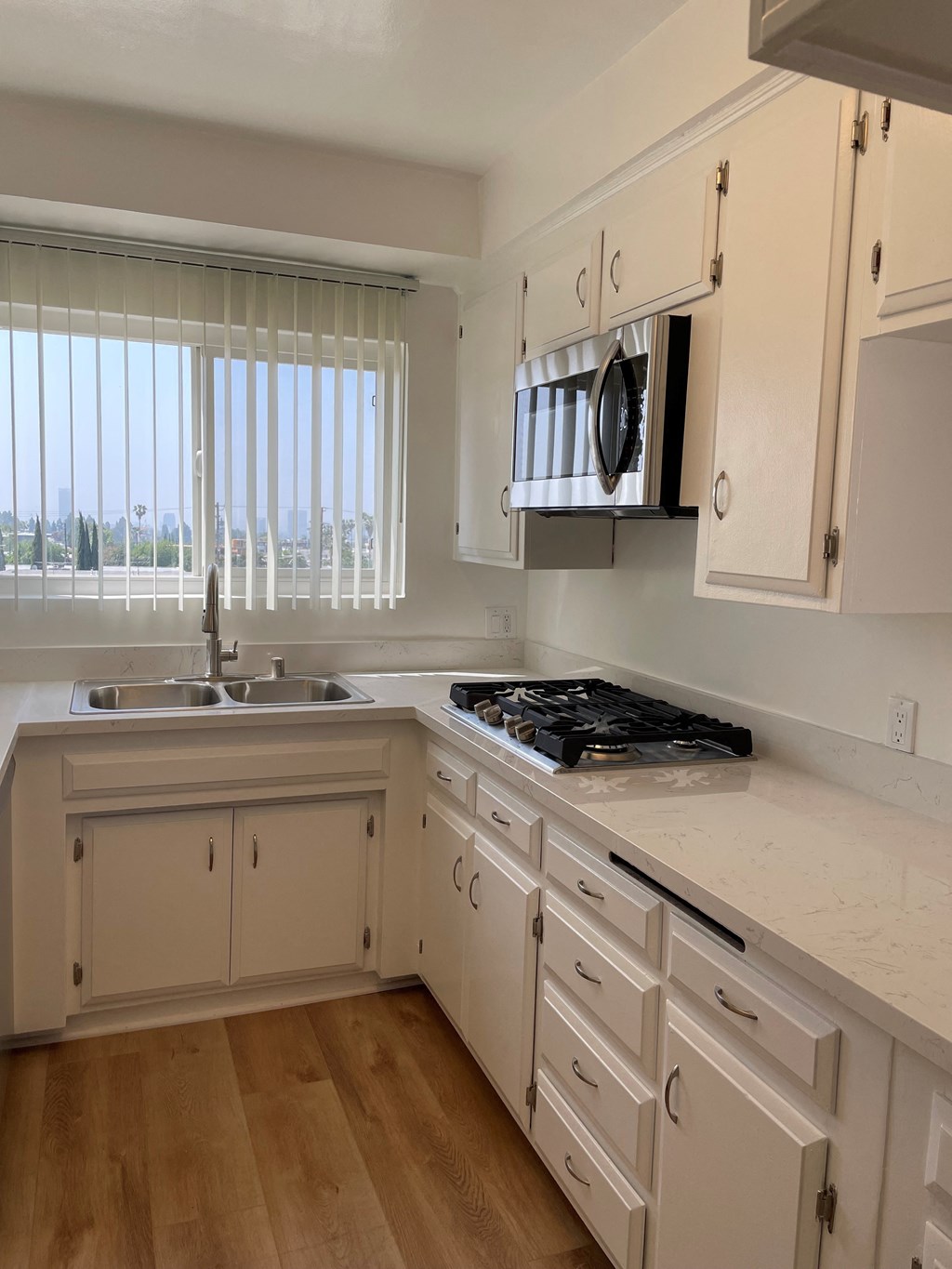 Kitchen with Stainless Steel Appliances and White Cabinets