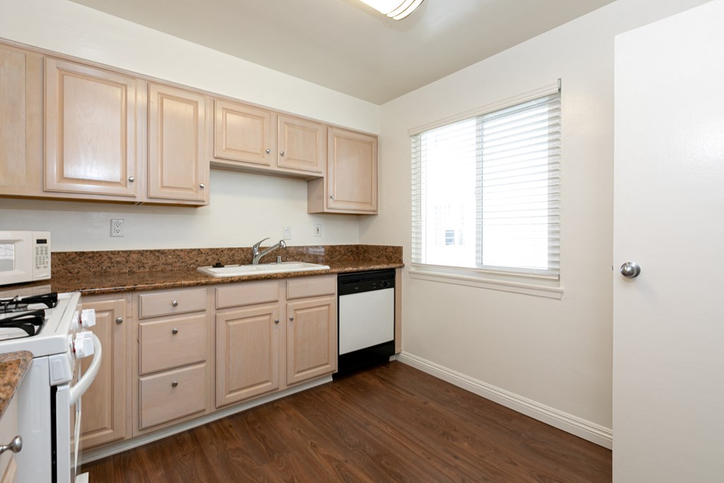 Kitchen with Wood Cabinets and White Appliances