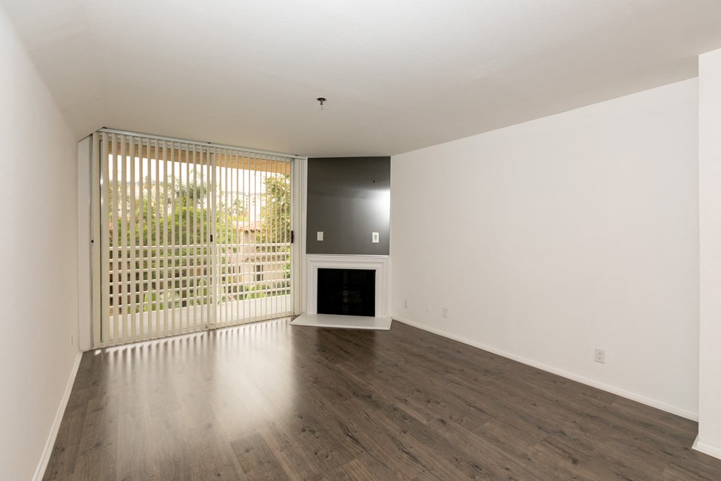 Living Room with Hardwood Floors, Fireplace and Patio Doors
