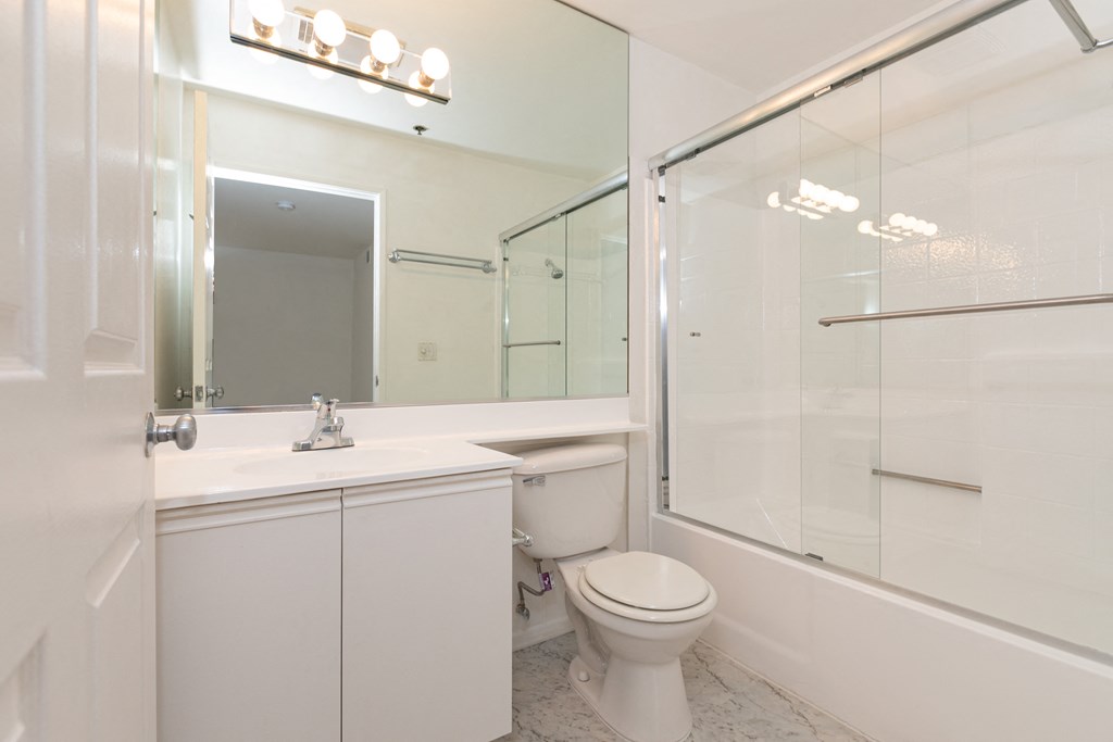Bathroom with White Cabinets and Bathtub/Shower
