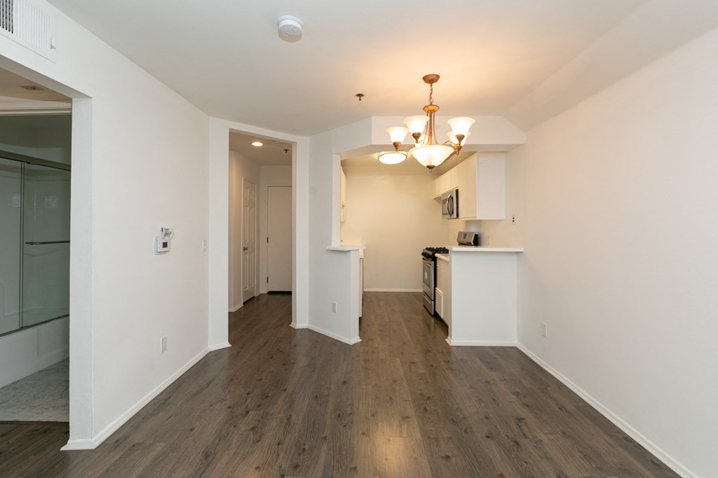 Dining Room with Chandelier and Hardwood Floors
