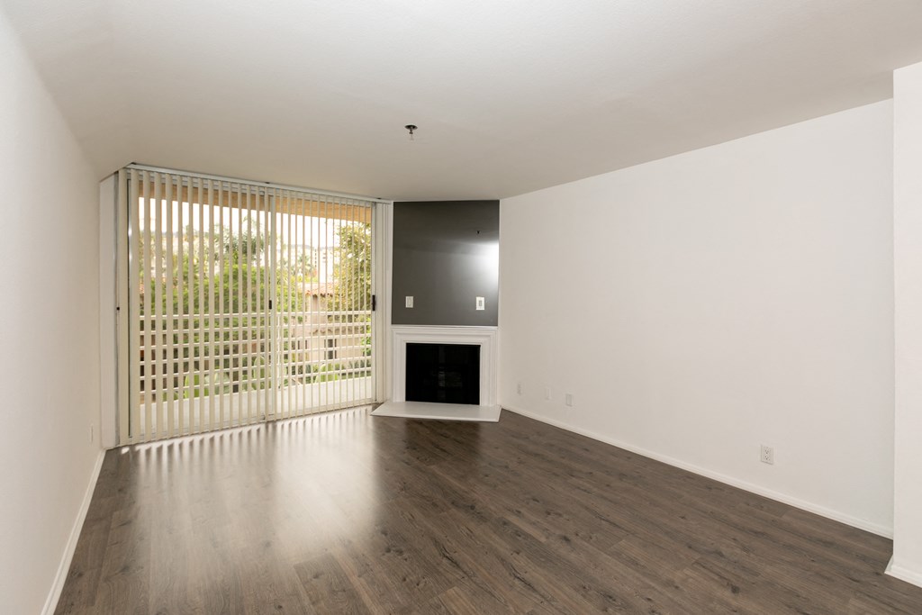 Living Room with Fireplace, Patio Doors and Hardwood Floors