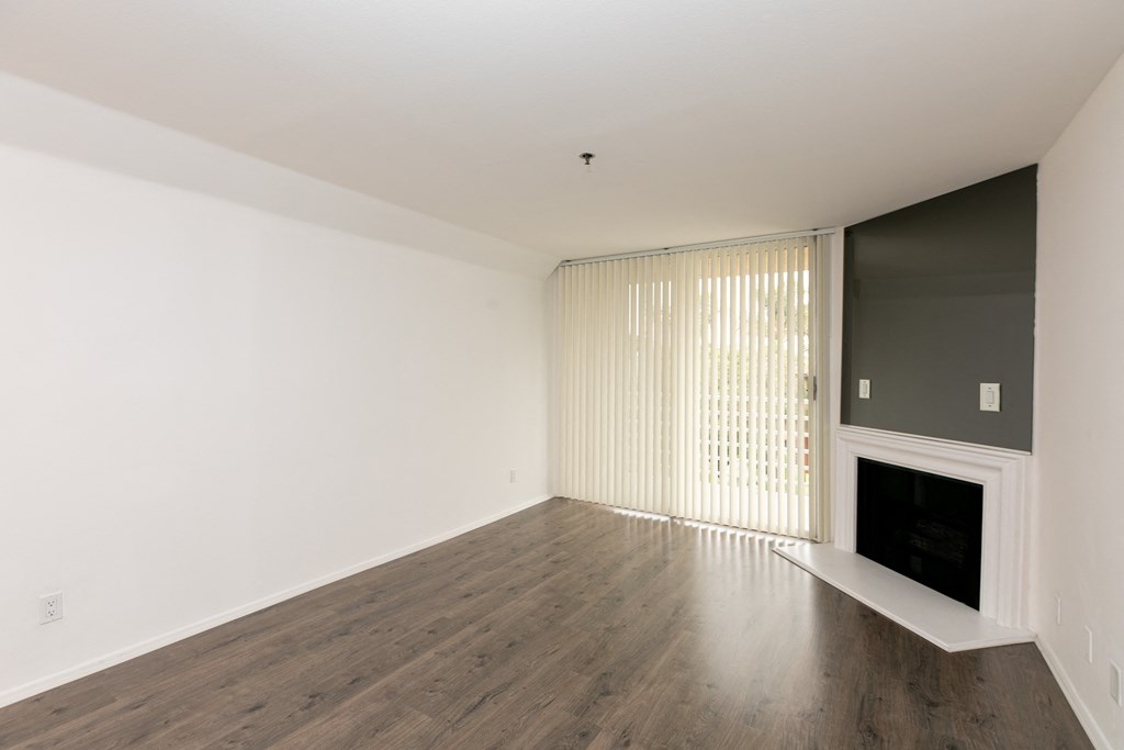 Living Room with Fireplace, Patio Doors and Hardwood Floors
