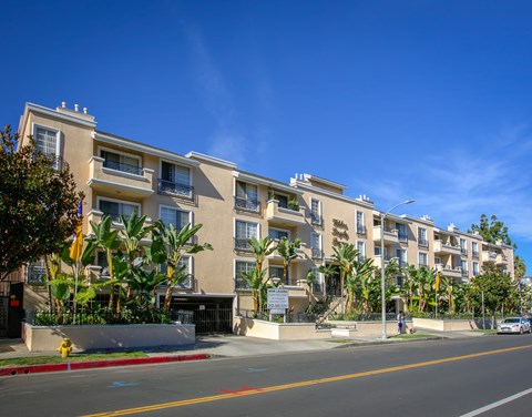 a row of apartment buildings on a city street