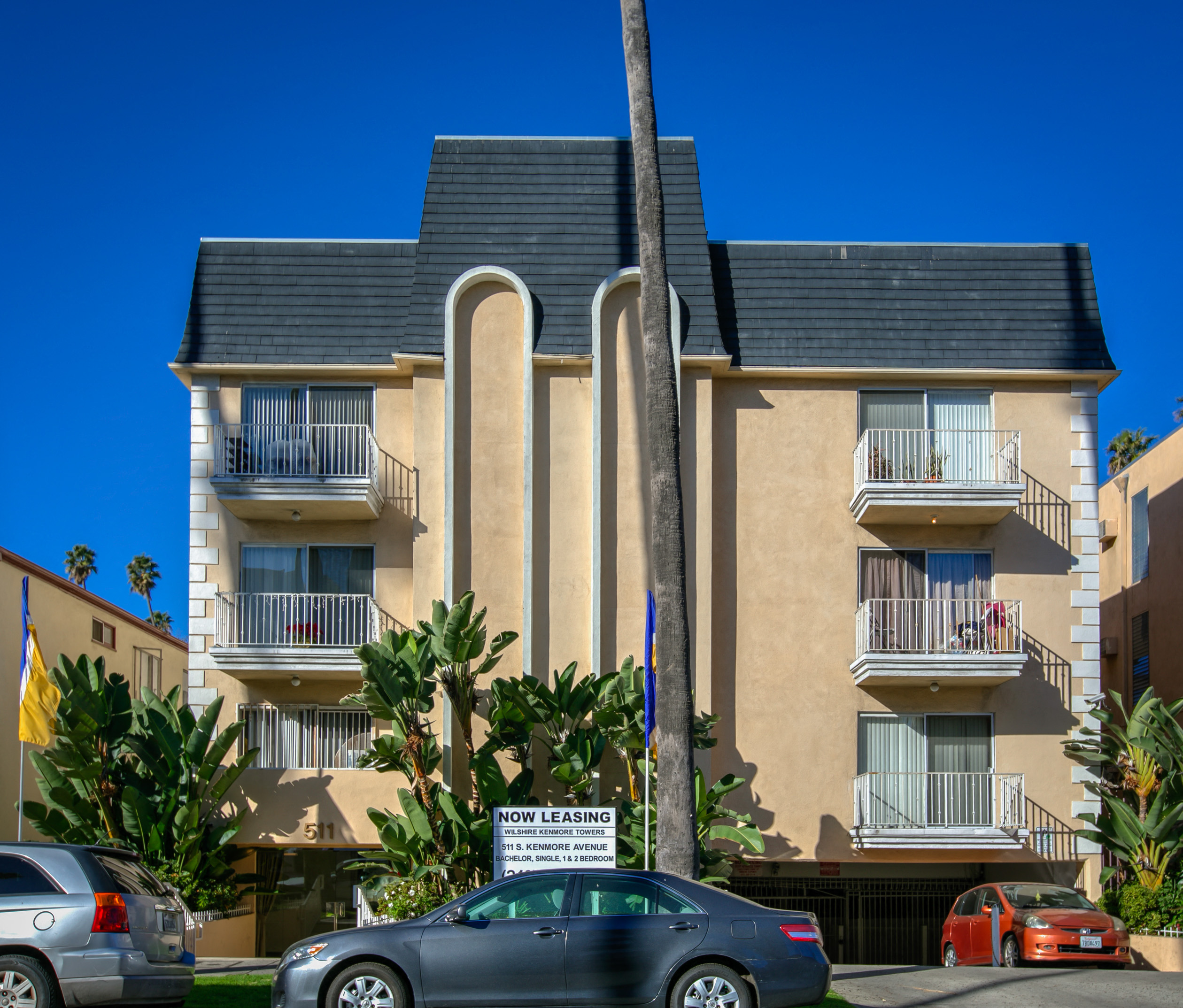 a building with cars parked in front of it