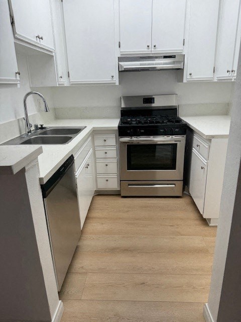 Kitchen with White Cabinets and Hardwood Floor