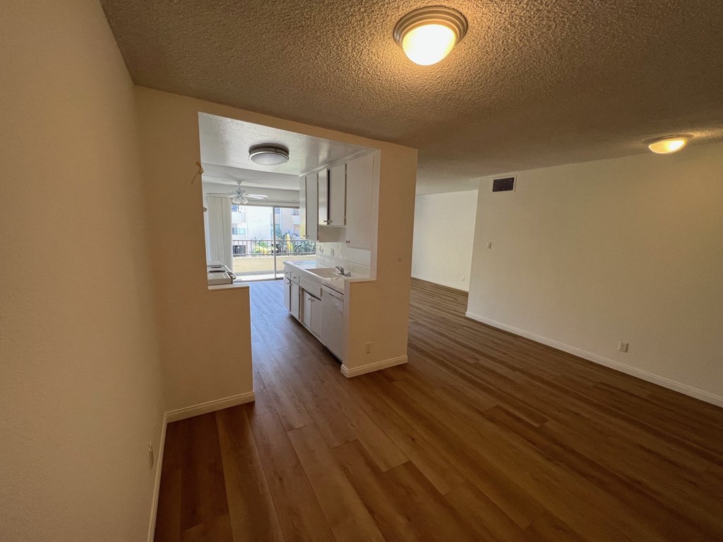 Dining Room with View of Kitchen with White Cabinets