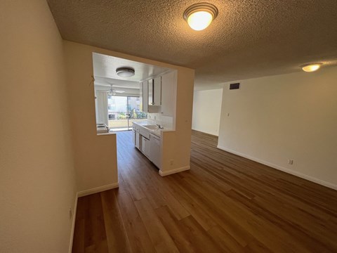 Dining Room with View of Kitchen with White Cabinets