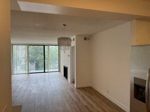 Living Room with Hardwood Floors, Fireplace and Patio Door