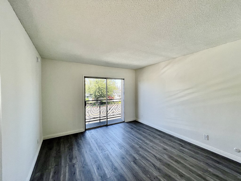 Bedroom with Hardwood Floors and Patio Doors