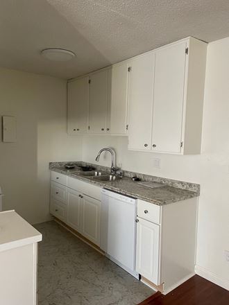 Kitchen with White Appliances and White Cabinets