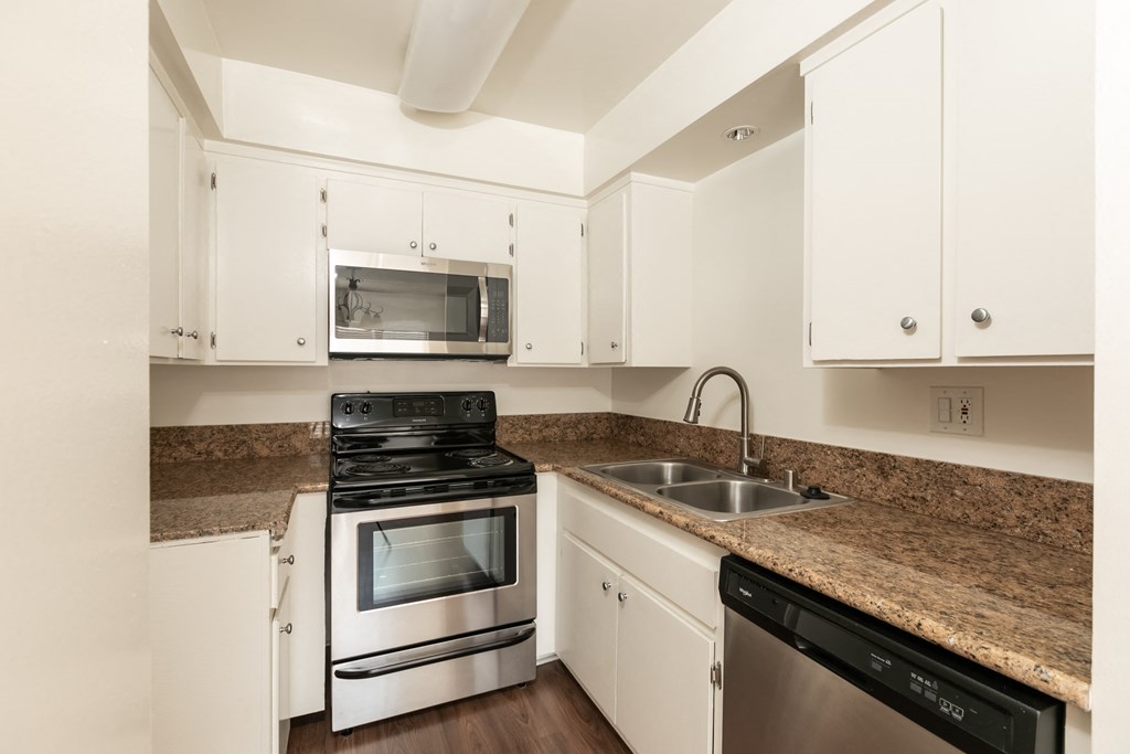 Kitchen with Stainless Steel Appliances and White Cabinets