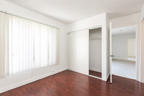 Bedroom with Hardwood Floors and Wardrobe Closet