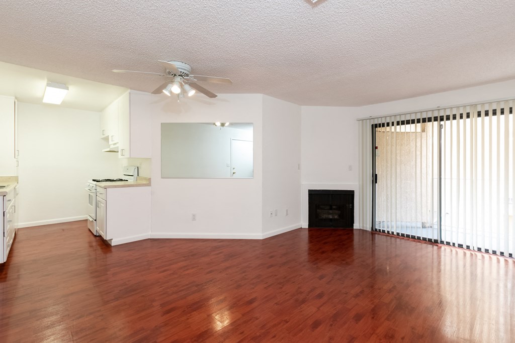 Living Room with Hardwood Floors, Fireplace and Patio Doors