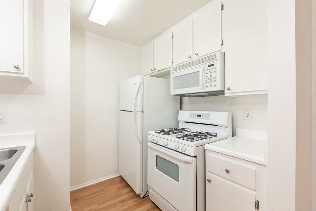 Kitchen with White Appliances and White Cabinets