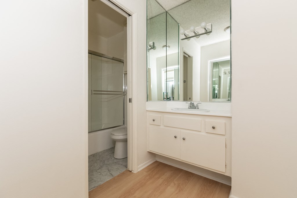Bathroom with White Cabinets and Bathrub/Shower