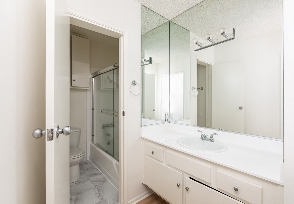 Bathroom with White Cabinets and Bathtub/Shower