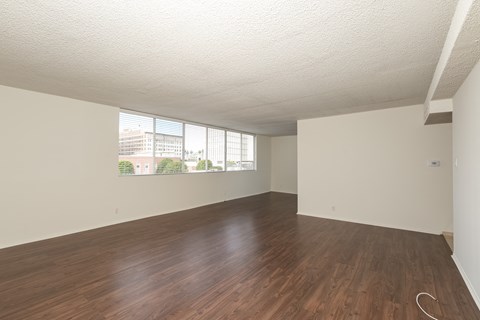 Bedroom with Hardwood Floors and Mirrored Wardrobe Closet
