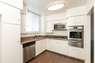 Kitchen with Stainless Steel Appliances and White Cabinets