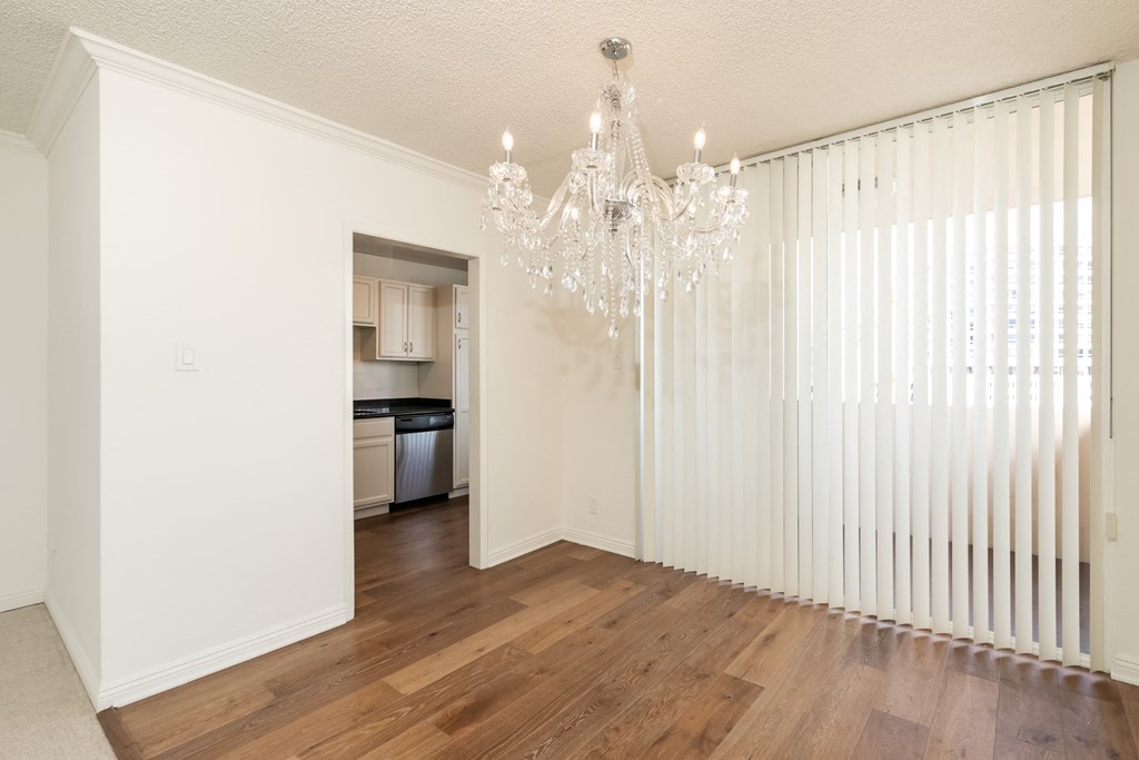 Dining Room with Hardwood Floors and Chandelier