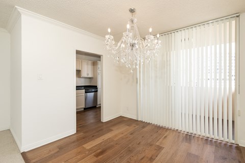 Dining Room with Hardwood Floors and Chandelier