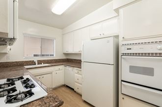 Kitchen with White Cabinets and White Appliances