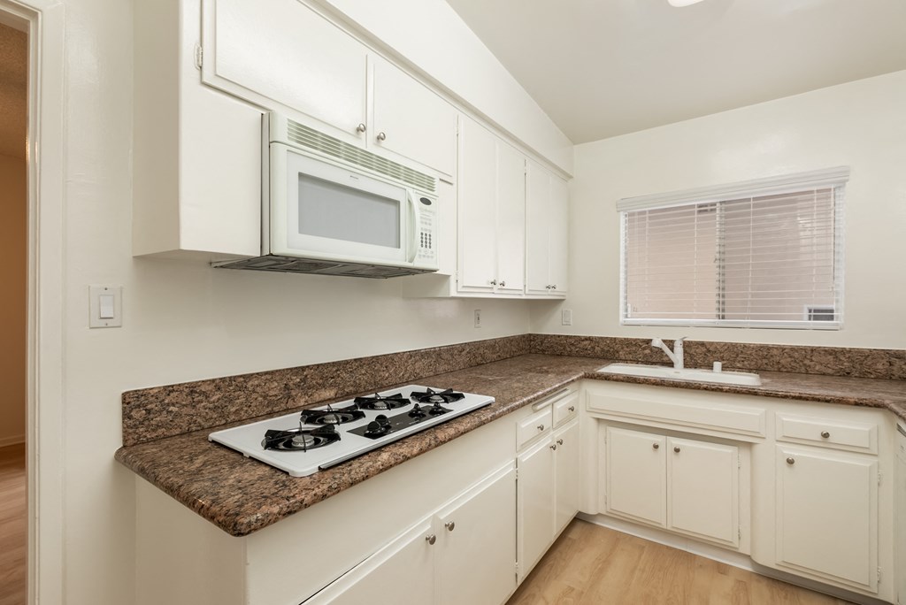 Kitchen with White Appliances and White Cabinets