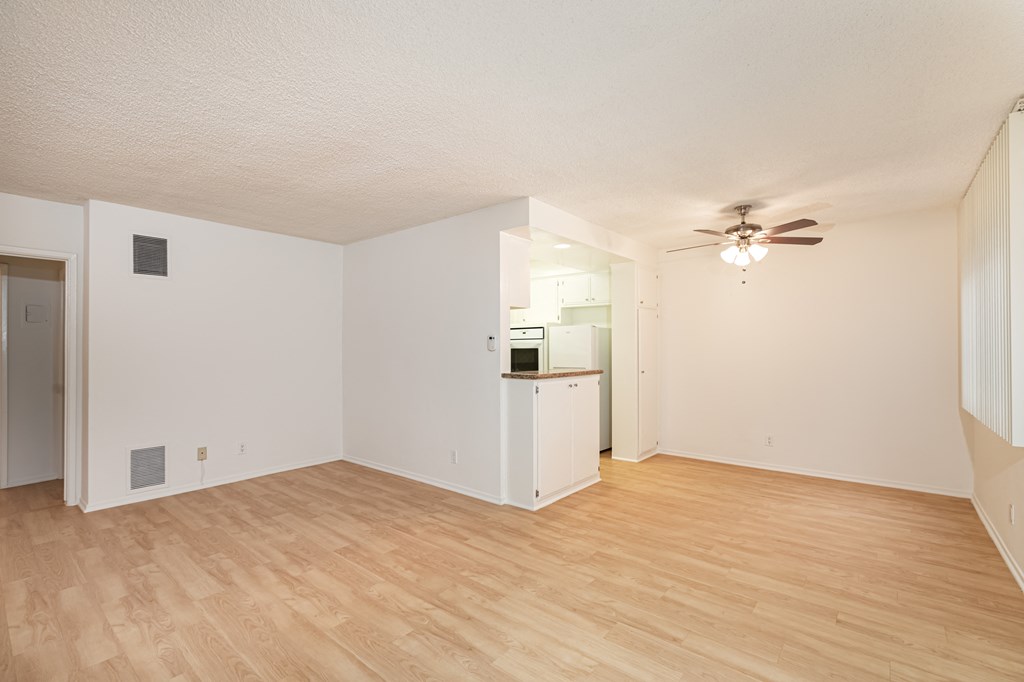 Living Room with Hardwood Floors and Fan