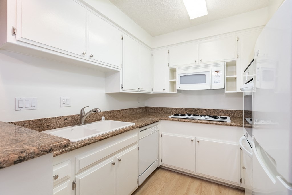 Kitchen with White Appliances and White Cabinets