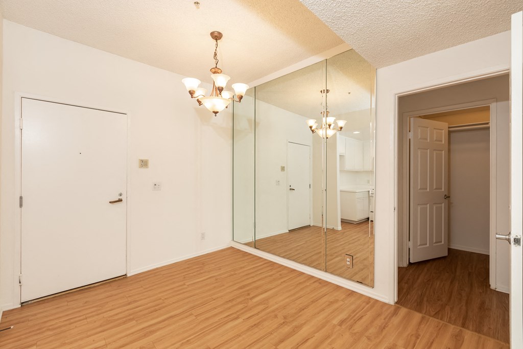 Dining Room with Chandelier and Hardwood Floors