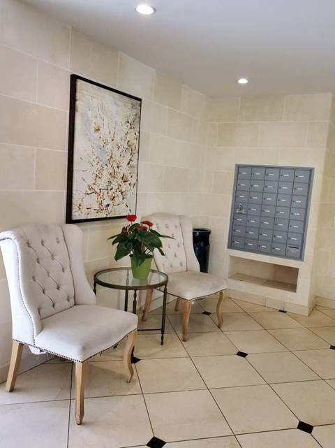 a living room with two chairs and a table