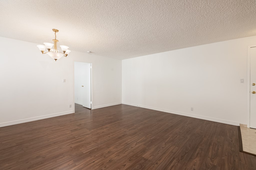 Dining Room with Hardwood Floors and Chandelier