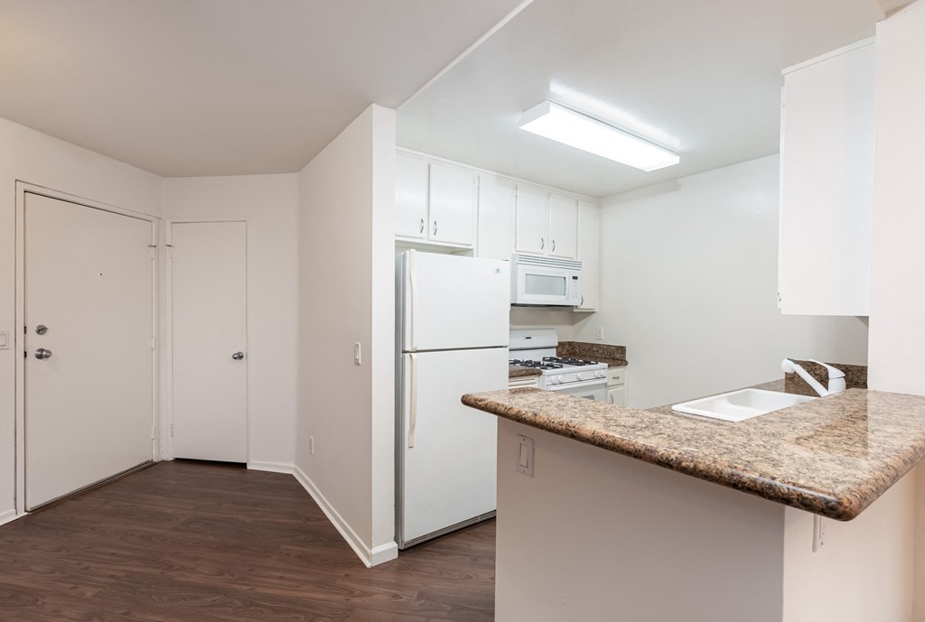 Kitchen with White Appliances and White Cabinets