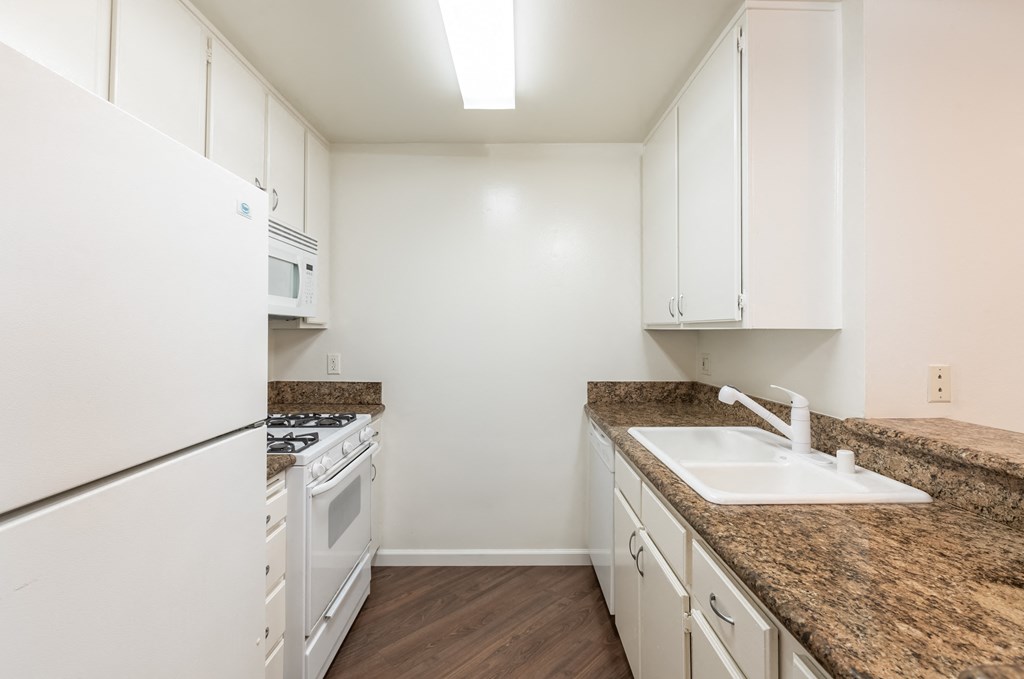 Kitchen with White Appliances and White Cabinets