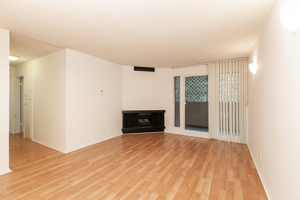 Living Room with Hardwood Floors, Fireplace and Patio Doors