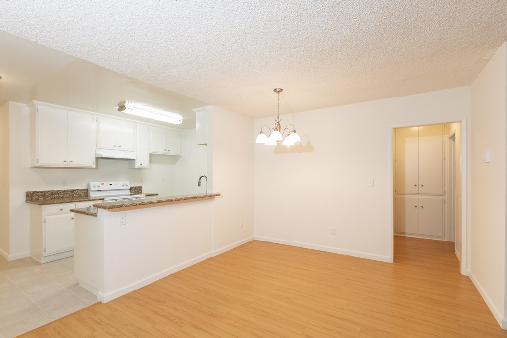 Dining Room with Hardwood Floors and Chandelier
