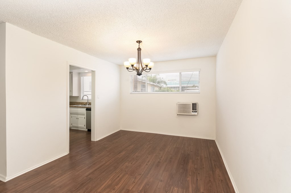 Dining Room with Hardwood Floors and Chandelier