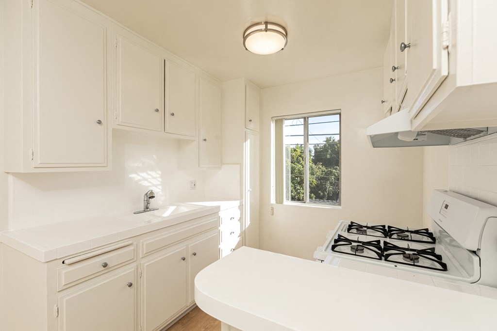 Kitchen with White Appliances and White Cabinets