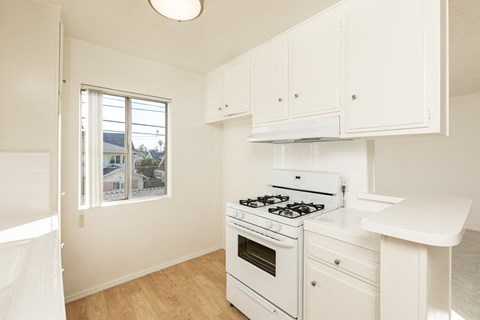 Kitchen with White Appliances and White Cabinets