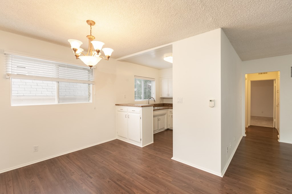 Dining Room with Hardwood Floors and Chandelier