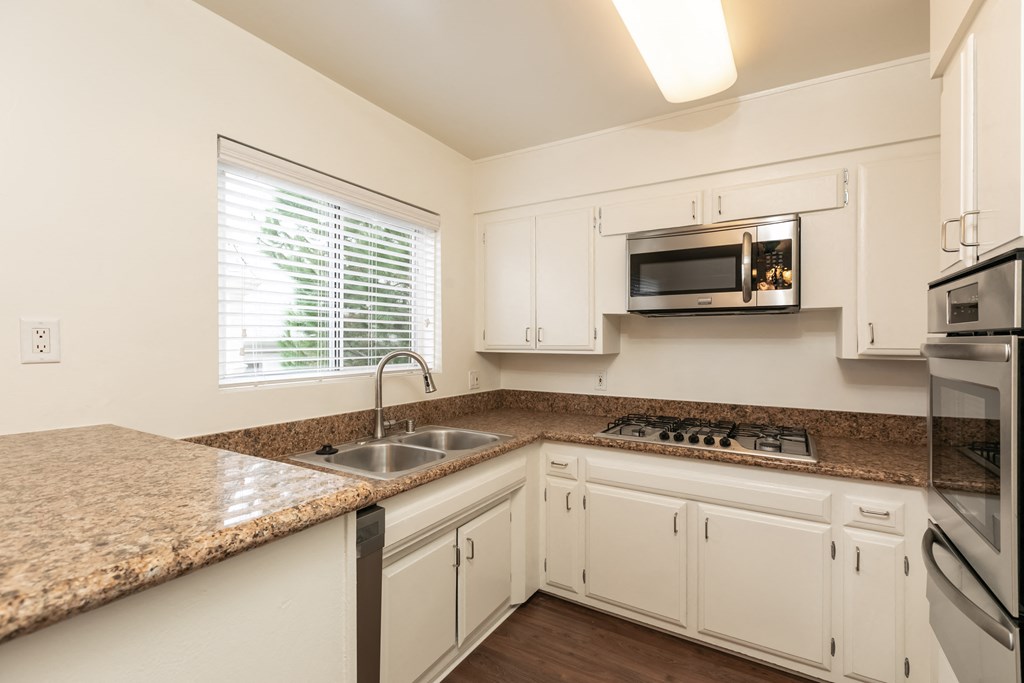 Kitchen with Stainless Steel Appliances and White Cabinets