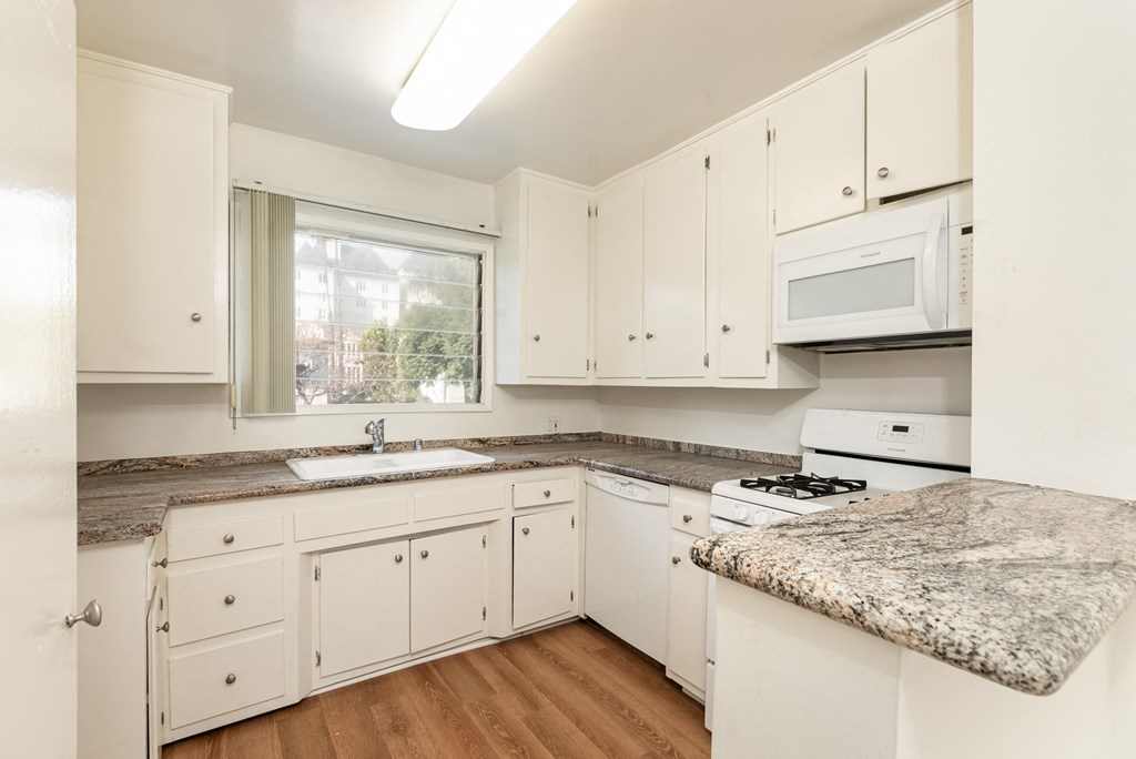 Kitchen with White Appliances and White Cabinets
