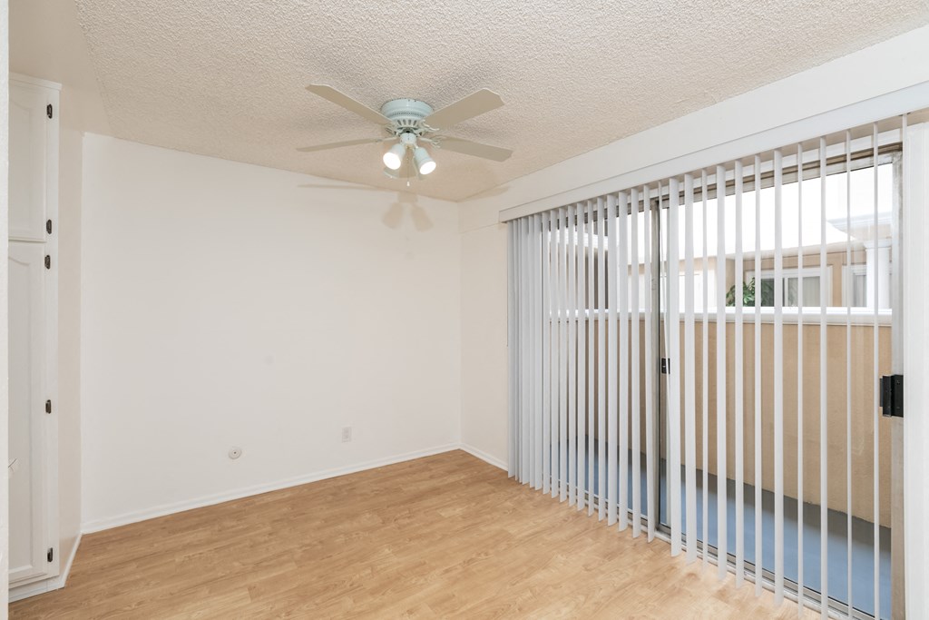 Dining Room with Hardwood Floors, Fan and Patio Doors