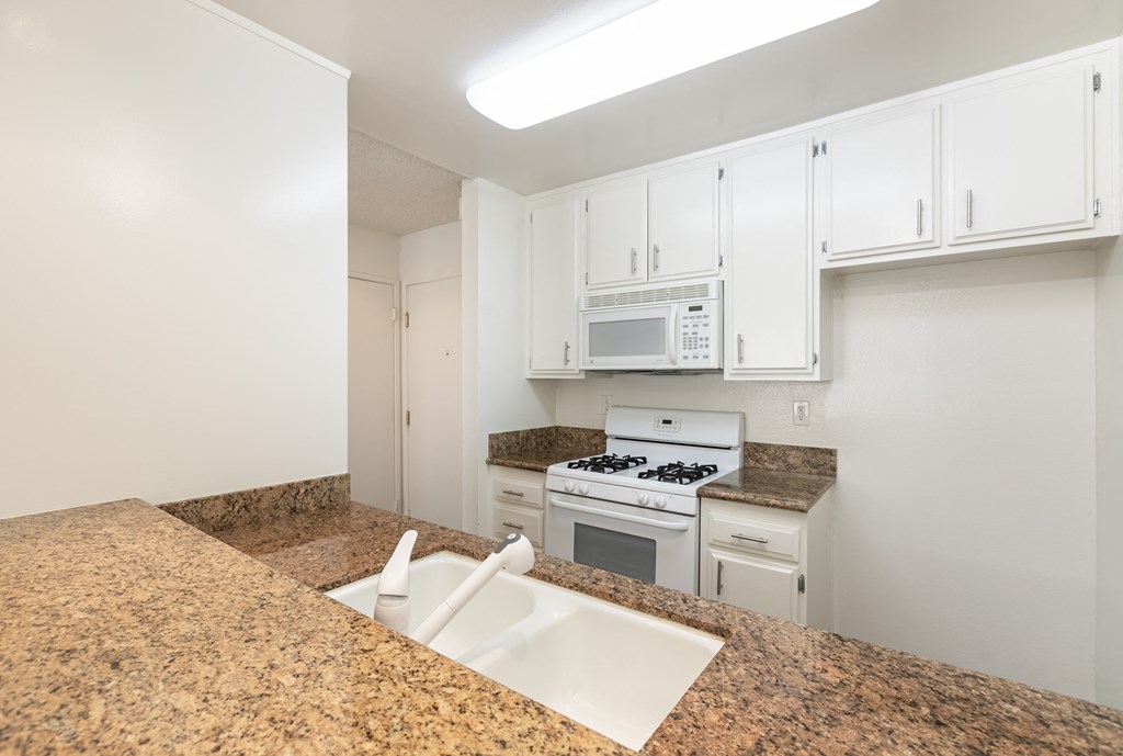 Kitchen with White Appliances and White Cabinets