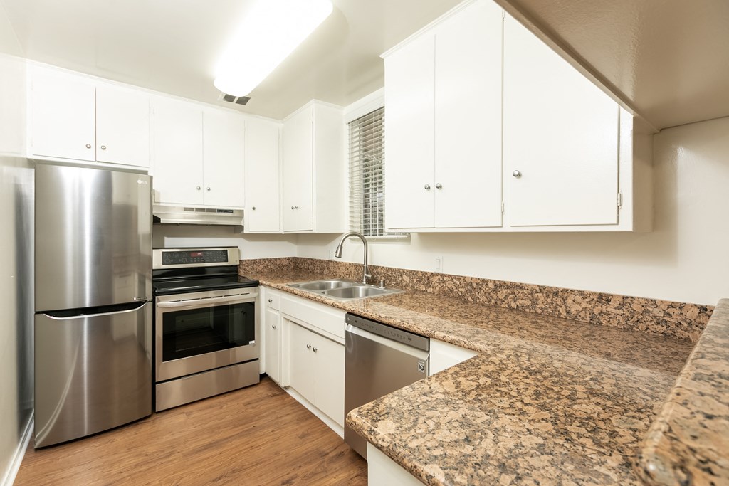 Kitchen with Stainless Steel Appliances and White Cabinets