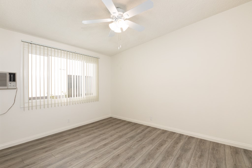 Bedroom with Hardwood Floors and Fan