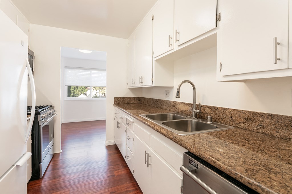 Kitchen with Stainless Steel Appliances and White Cabinets