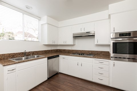Kitchen with Stainless Steel Appliances and White Cabinets